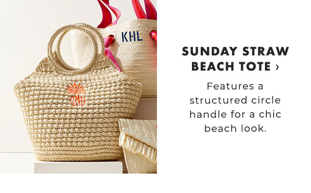 SUNDAY STRAW BEACH TOTE › Features a structured circle handle for a chic beach look.