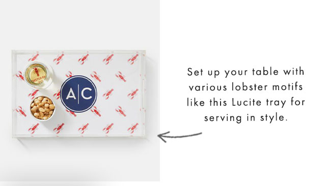 Set up your table with various lobster motifs like this Lucite tray for serving in style.