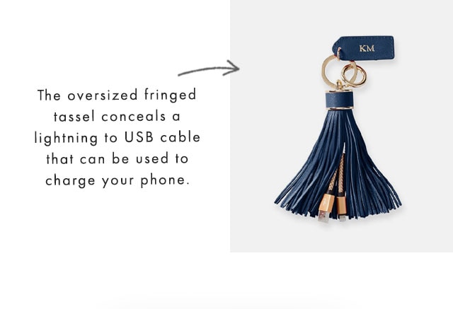 The oversized fringed tassel conceals a lightning to USB cable that can be used to charge your phone.