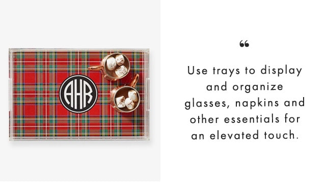 Use trays to display and organize glasses, napkins and other essentials for an elevated touch.