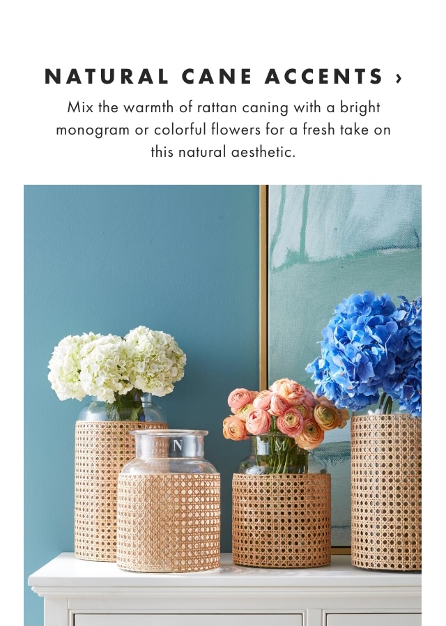 NATURAL CANE ACCENTS › Mix the warmth of rattan caning with a bright monogram or colorful flowers for a fresh take on this natural aesthetic. 