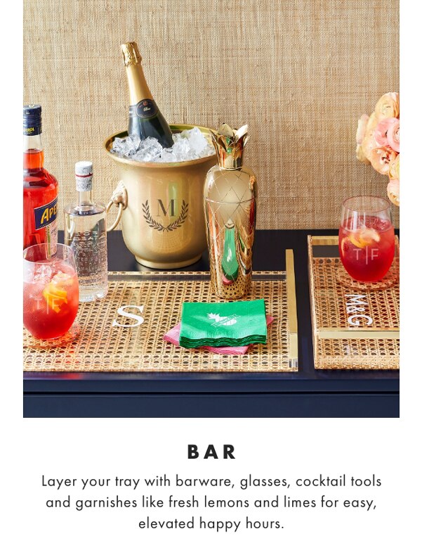 BAR - Layer your tray with barware, glasses, cocktail tools and garnishes like fresh lemons and limes for easy, elevated happy hours. 