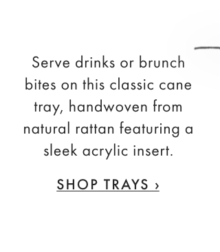 Serve drinks or brunch bites on this classic cane tray, handwoven from natural rattan featuring a sleek acrylic insert. - SHOP TRAYS ›