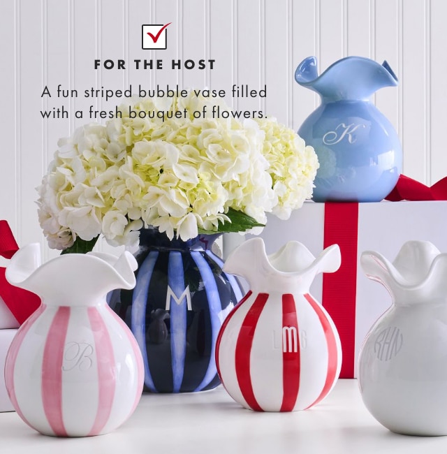 FOR THE HOST - A fun striped bubble vase filled with a fresh bouquet of flowers.